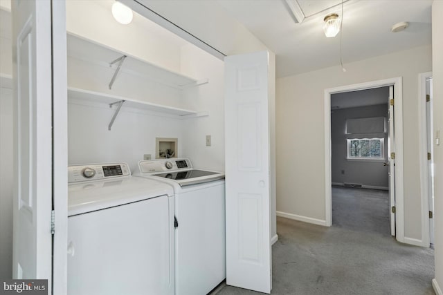 laundry room featuring baseboards, carpet floors, laundry area, attic access, and independent washer and dryer