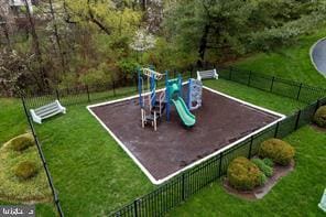 view of playground with a yard and fence