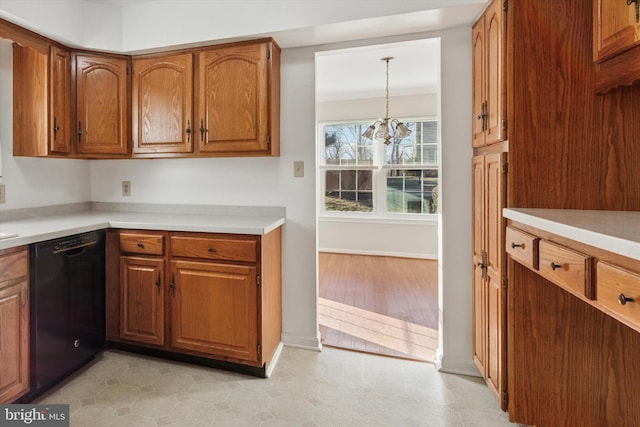 kitchen with an inviting chandelier, brown cabinets, dishwasher, and light countertops