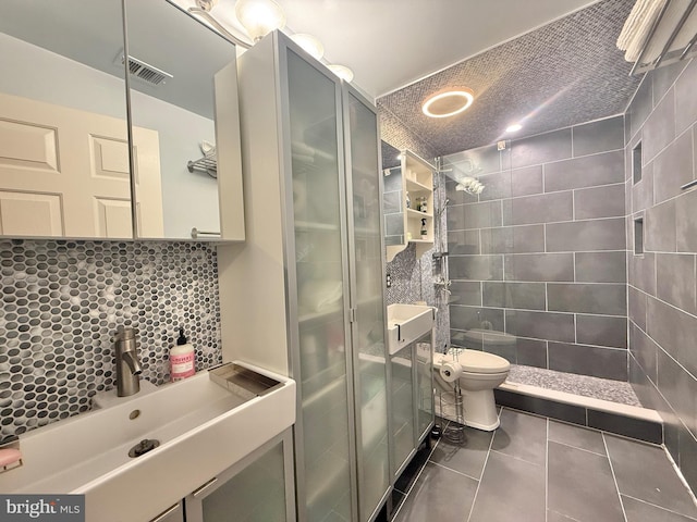 full bathroom with visible vents, a shower stall, toilet, tile patterned floors, and vanity