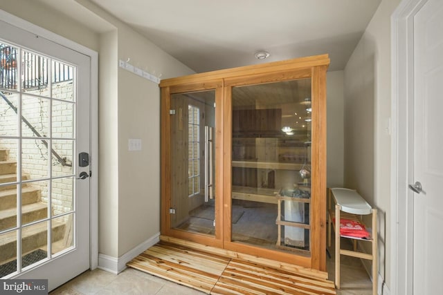 view of sauna / steam room featuring tile patterned floors and baseboards