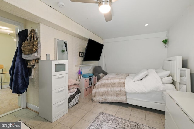 bedroom featuring light tile patterned floors and a ceiling fan