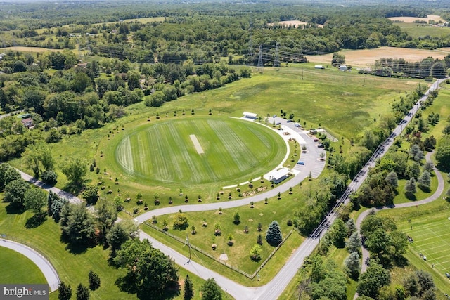 birds eye view of property with a rural view