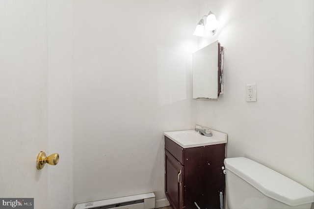 half bath with vanity, toilet, and a baseboard radiator