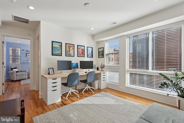 home office featuring visible vents, recessed lighting, and light wood-style floors