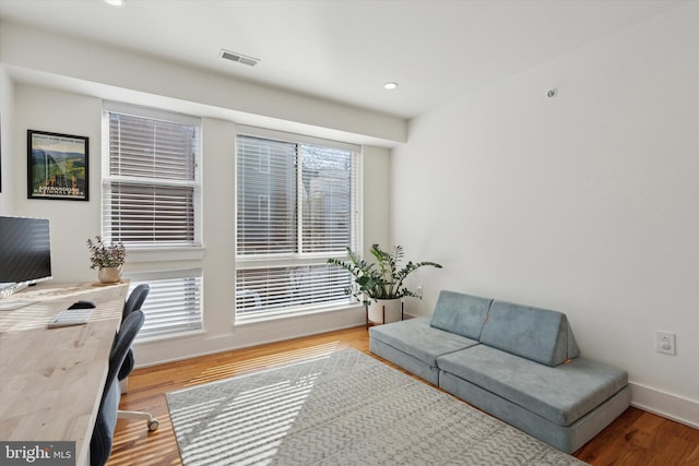 office with recessed lighting, visible vents, baseboards, and wood finished floors