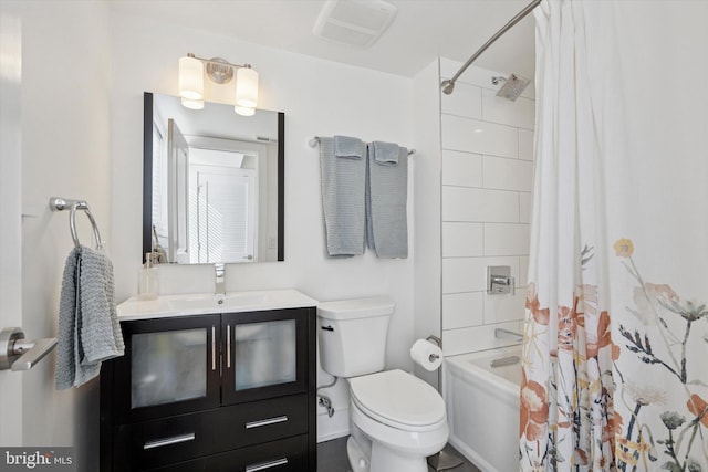 bathroom with visible vents, vanity, toilet, and shower / bath combo with shower curtain