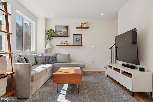 living area with recessed lighting and baseboards