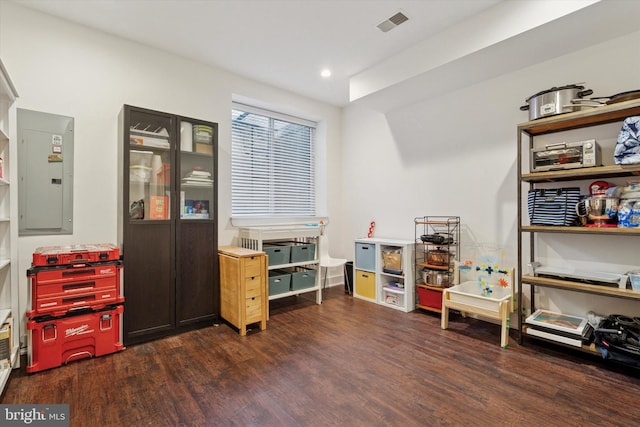 rec room featuring electric panel, visible vents, recessed lighting, and wood finished floors