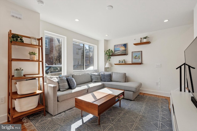 living area featuring recessed lighting, dark wood-type flooring, and baseboards