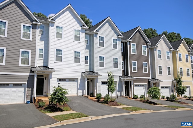 2444 Winthrop Dr, Charlottesville, VA 22911 - townhome / multi-family property featuring driveway, a standing seam roof, a residential view, an attached garage, and metal roof