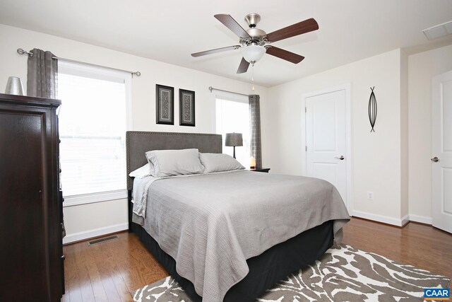 2444 Winthrop Dr, Charlottesville, VA 22911 - bedroom with visible vents, baseboards, dark wood-style floors, and a ceiling fan