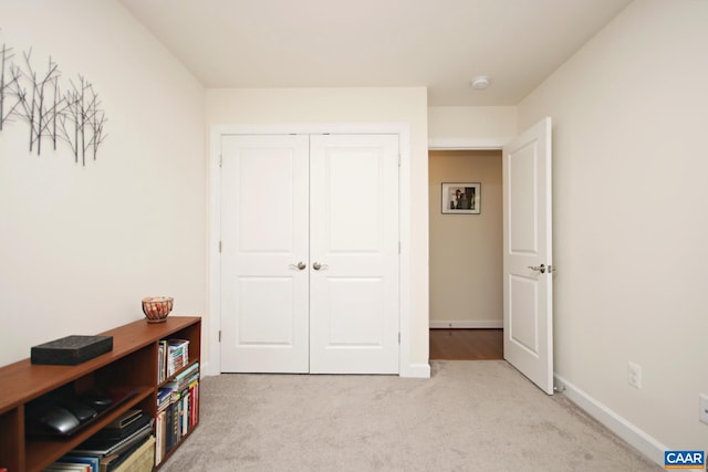 2444 Winthrop Dr, Charlottesville, VA 22911 - bedroom featuring light colored carpet, a closet, and baseboards