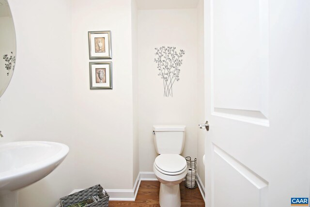 2444 Winthrop Dr, Charlottesville, VA 22911 - bathroom with toilet, wood finished floors, baseboards, and a sink