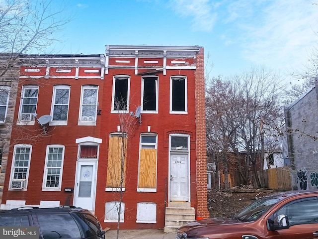 multi unit property with entry steps and brick siding