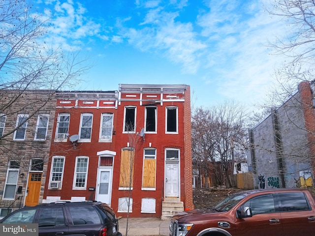 townhome / multi-family property with brick siding