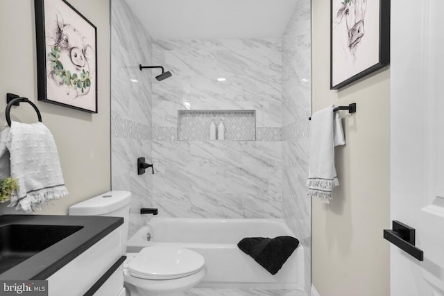 full bathroom featuring vanity, toilet, marble finish floor, and shower / bath combination