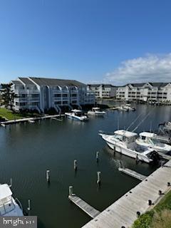 property view of water featuring a boat dock