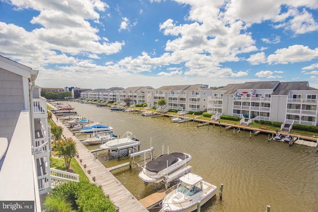 dock area with a water view and boat lift