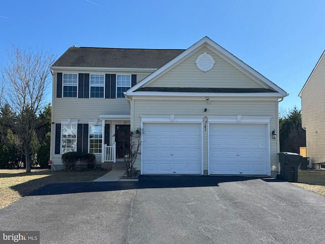 view of front facade featuring driveway and an attached garage