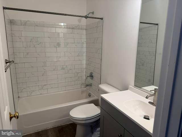 full bath with shower / bath combination, toilet, vanity, and wood finished floors