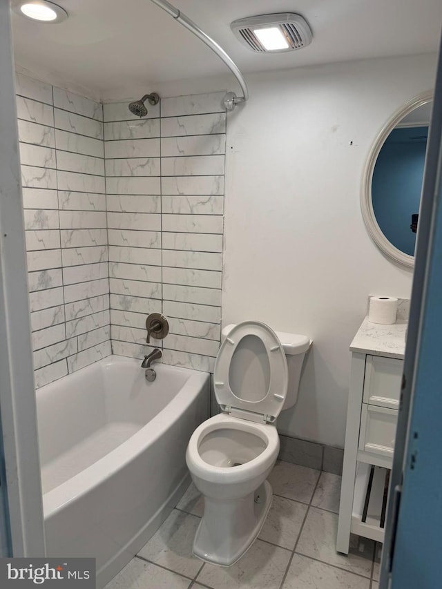 full bath featuring vanity, baseboards, visible vents, shower / washtub combination, and toilet