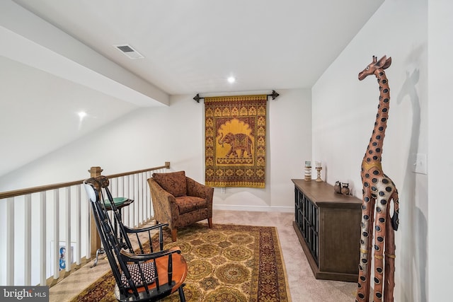 sitting room with light carpet, visible vents, recessed lighting, and lofted ceiling