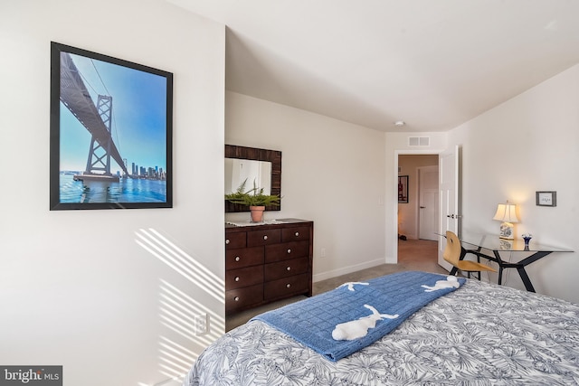 carpeted bedroom with baseboards and visible vents