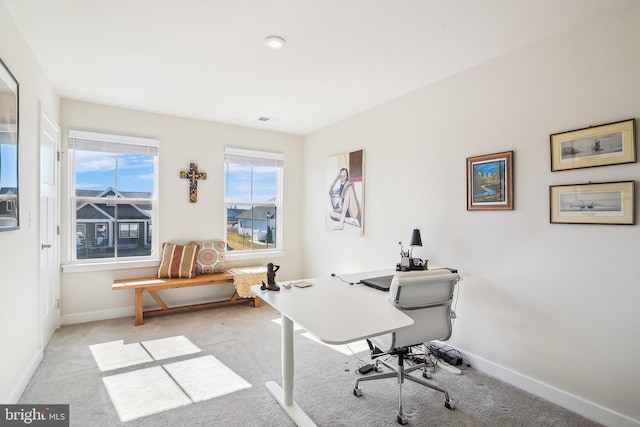 office area featuring carpet and baseboards