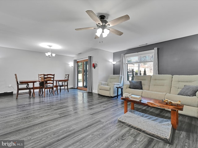 living room featuring ceiling fan, wood finished floors, visible vents, and baseboards