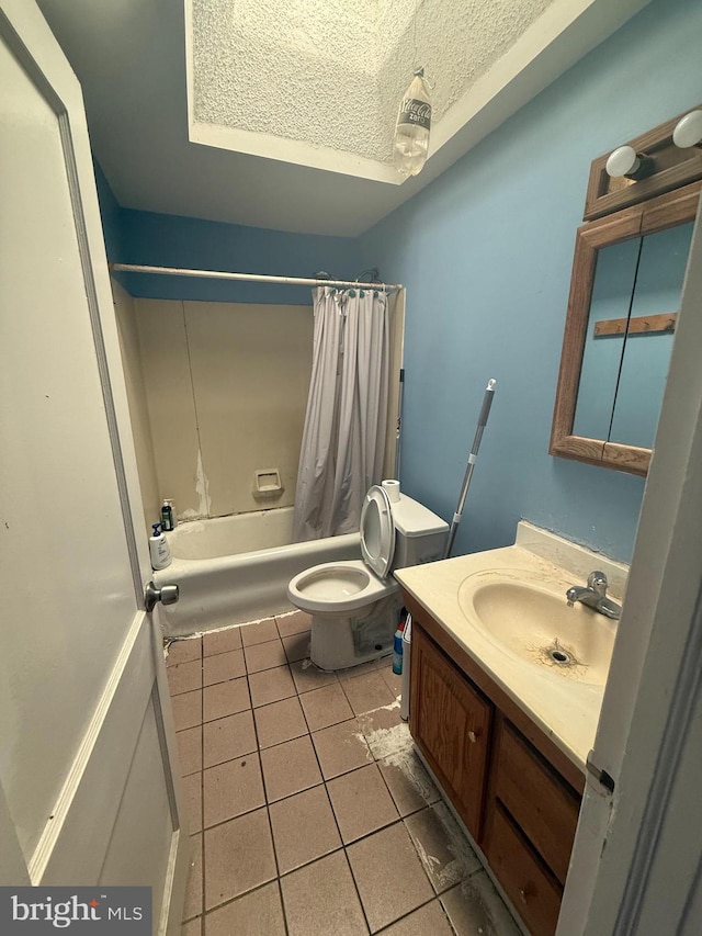 full bathroom featuring toilet, a textured ceiling, shower / tub combo, tile patterned flooring, and vanity