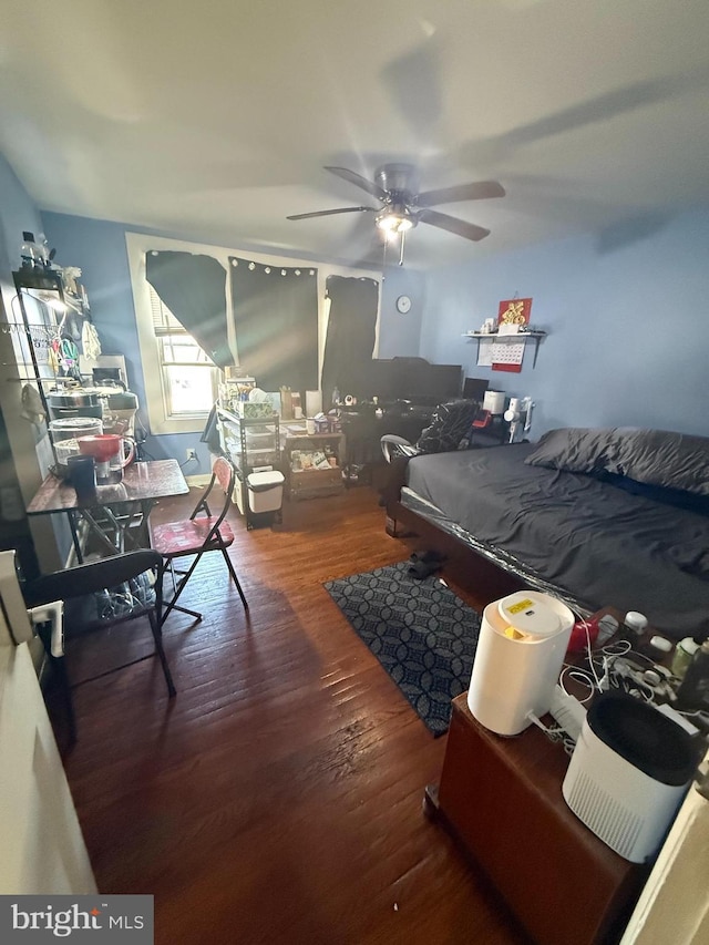 bedroom with ceiling fan and wood finished floors