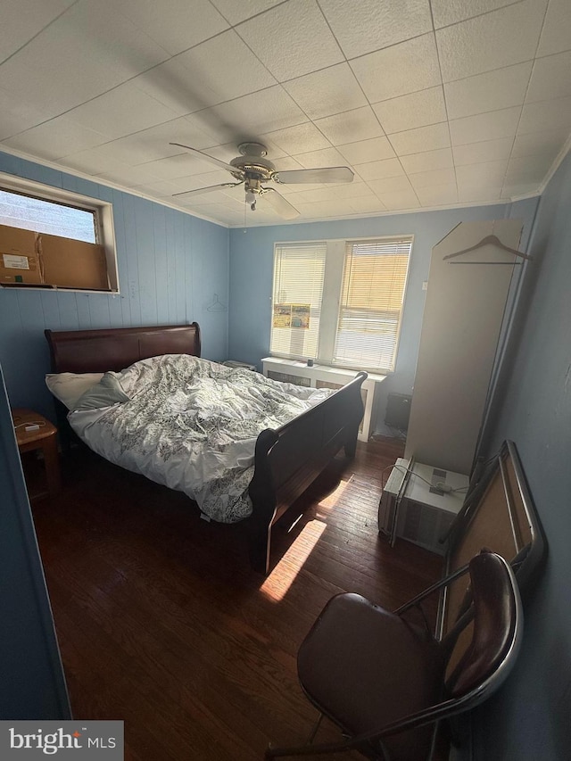 bedroom featuring ceiling fan and wood finished floors