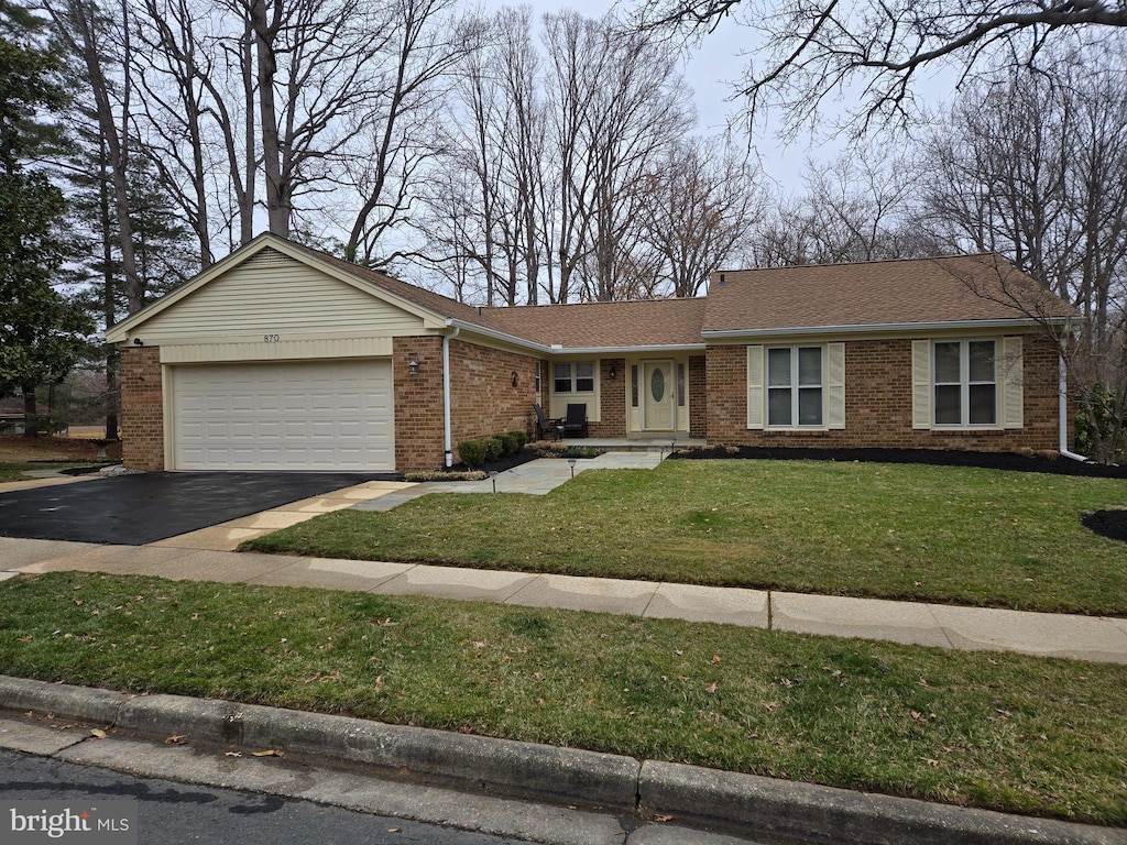 single story home with a front yard, driveway, roof with shingles, a garage, and brick siding