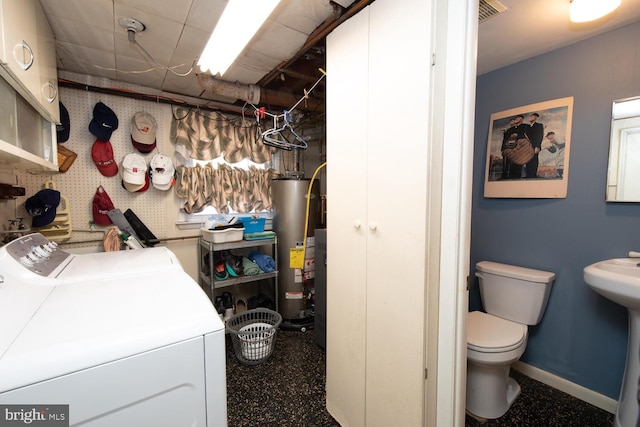 laundry room featuring independent washer and dryer, a sink, gas water heater, baseboards, and laundry area