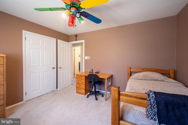 bedroom featuring ceiling fan, baseboards, and carpet