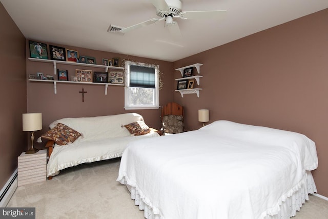 bedroom featuring a baseboard heating unit, carpet flooring, visible vents, and ceiling fan