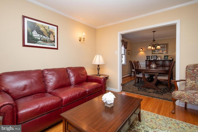 living area featuring light wood-style flooring, ornamental molding, a baseboard radiator, baseboards, and a chandelier