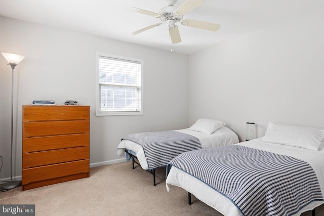 bedroom featuring baseboards, a ceiling fan, and carpet flooring