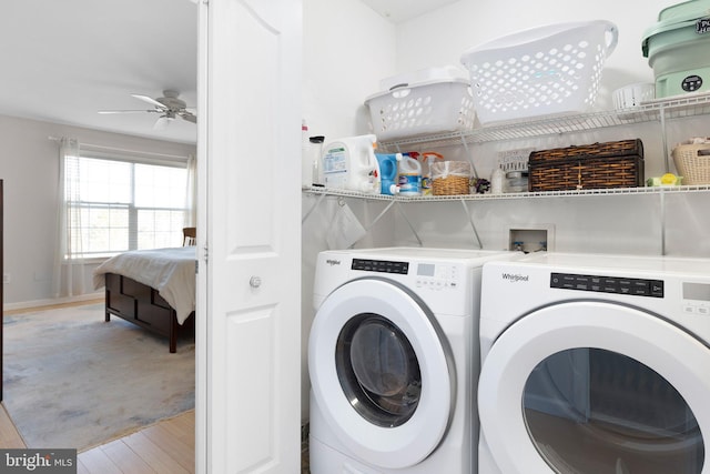 laundry room with washing machine and clothes dryer, laundry area, ceiling fan, and wood finished floors