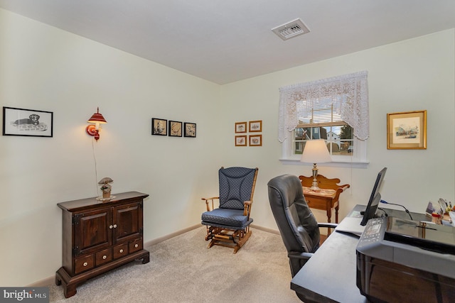 home office with visible vents, carpet flooring, and baseboards