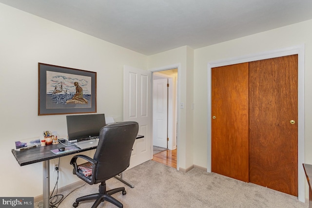 carpeted office with baseboards