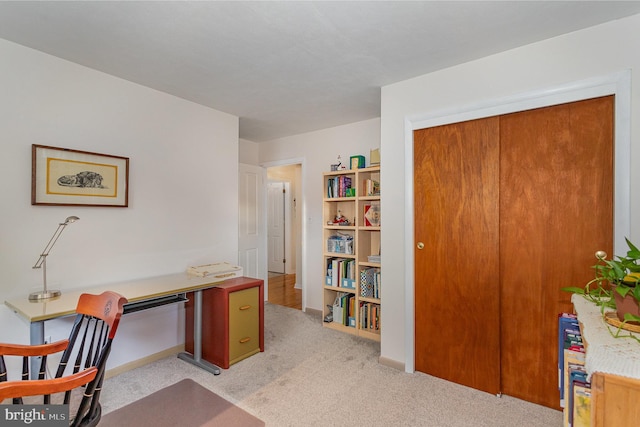 office with light colored carpet and baseboards