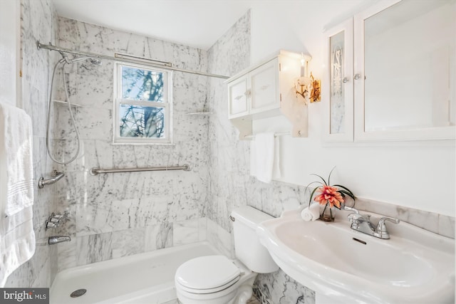 full bathroom with a sink, toilet, and a stall shower