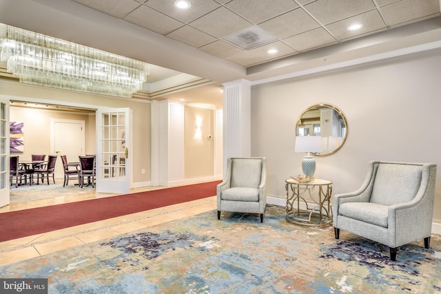 sitting room with recessed lighting, french doors, baseboards, and a paneled ceiling