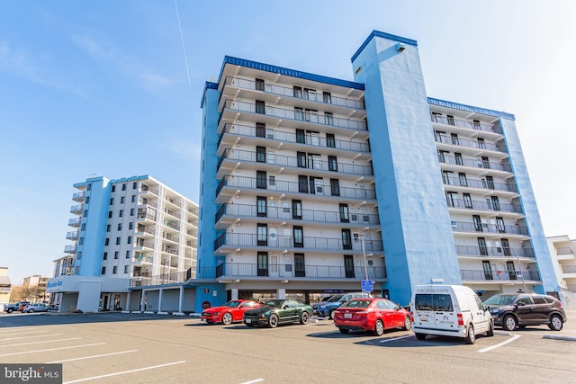 view of property with uncovered parking