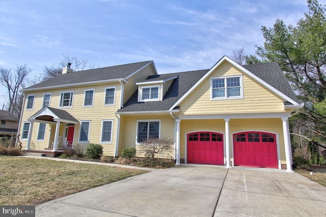 view of front of house featuring concrete driveway, a front yard, and a shingled roof