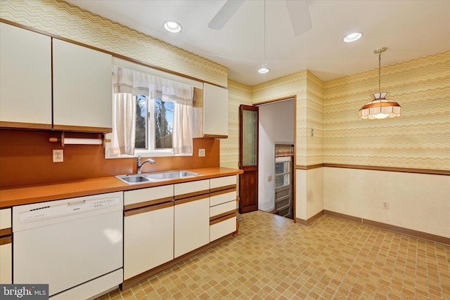 kitchen featuring a sink, white cabinetry, recessed lighting, light countertops, and dishwasher