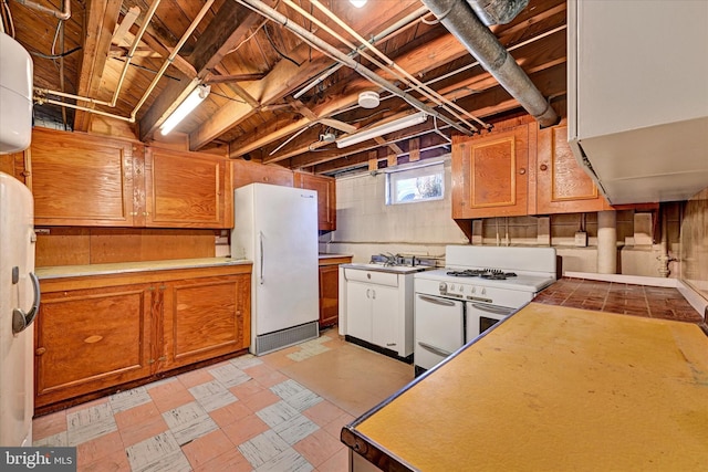 kitchen featuring white appliances, light floors, brown cabinets, and light countertops