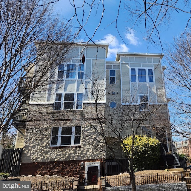 view of side of property with a fenced front yard